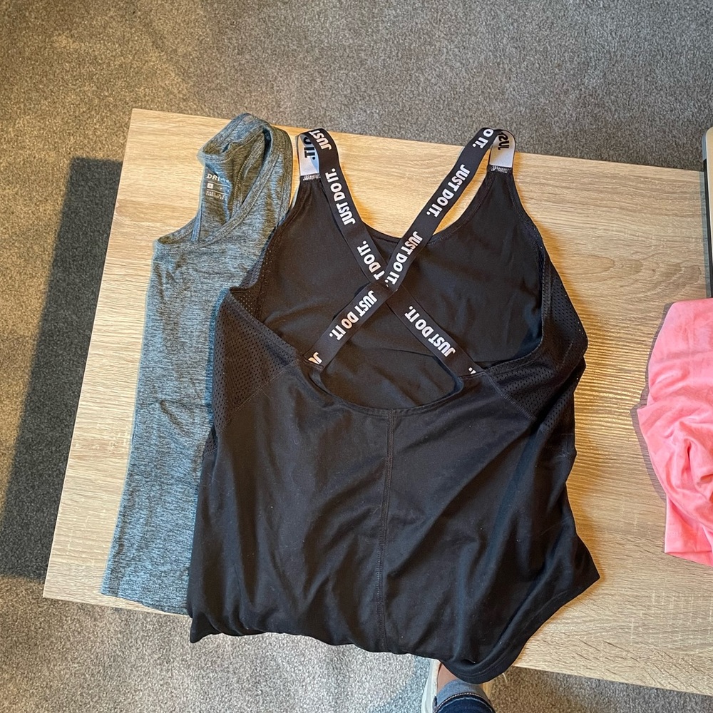 Gray and black Nike workout tank tops